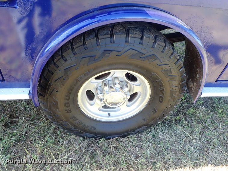 image for item DB7700 2003 Ford F250 Super Duty Crew Cab flatbed pickup truck