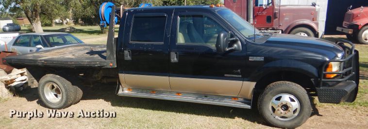 image for item DD4503 1999 Ford F350 Super Duty Crew Cab flatbed pickup truck