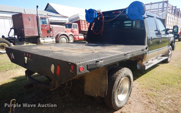 image for item DD4503 1999 Ford F350 Super Duty Crew Cab flatbed pickup truck