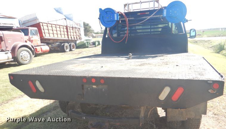 image for item DD4503 1999 Ford F350 Super Duty Crew Cab flatbed pickup truck