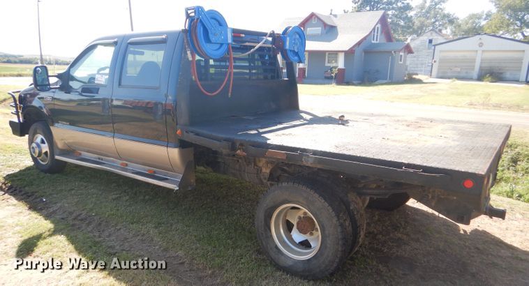 image for item DD4503 1999 Ford F350 Super Duty Crew Cab flatbed pickup truck