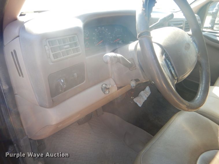 image for item DD4503 1999 Ford F350 Super Duty Crew Cab flatbed pickup truck