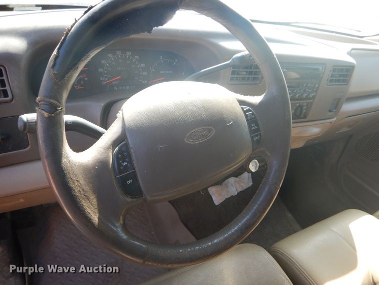 image for item DD4503 1999 Ford F350 Super Duty Crew Cab flatbed pickup truck