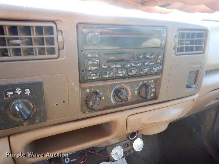 image for item DD4503 1999 Ford F350 Super Duty Crew Cab flatbed pickup truck