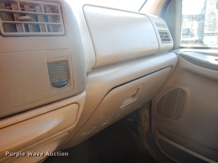 image for item DD4503 1999 Ford F350 Super Duty Crew Cab flatbed pickup truck