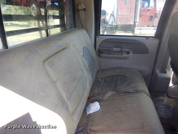 image for item DD4503 1999 Ford F350 Super Duty Crew Cab flatbed pickup truck