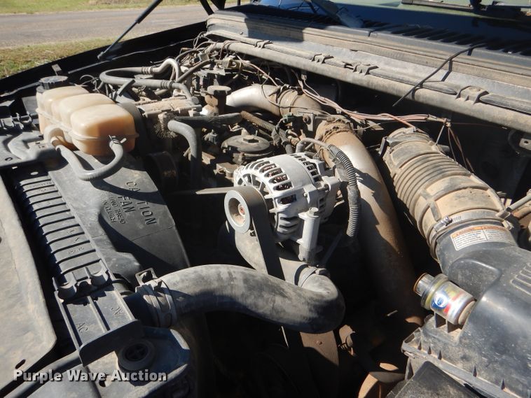 image for item DD4503 1999 Ford F350 Super Duty Crew Cab flatbed pickup truck