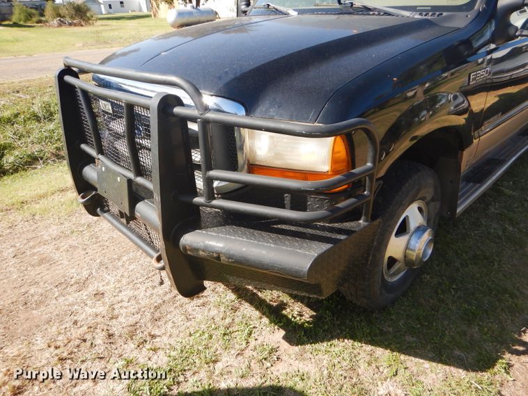 image for item DD4503 1999 Ford F350 Super Duty Crew Cab flatbed pickup truck