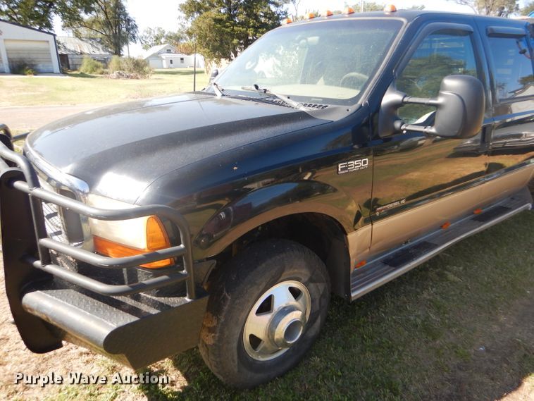 image for item DD4503 1999 Ford F350 Super Duty Crew Cab flatbed pickup truck