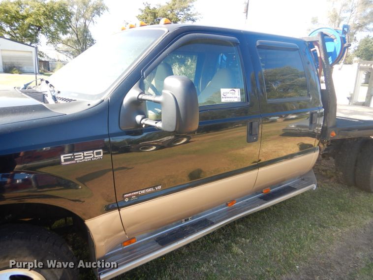 image for item DD4503 1999 Ford F350 Super Duty Crew Cab flatbed pickup truck