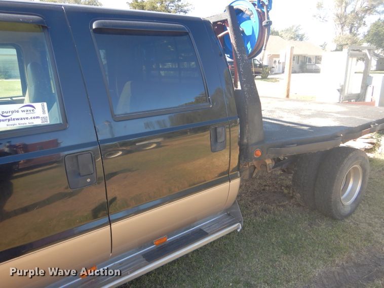 image for item DD4503 1999 Ford F350 Super Duty Crew Cab flatbed pickup truck