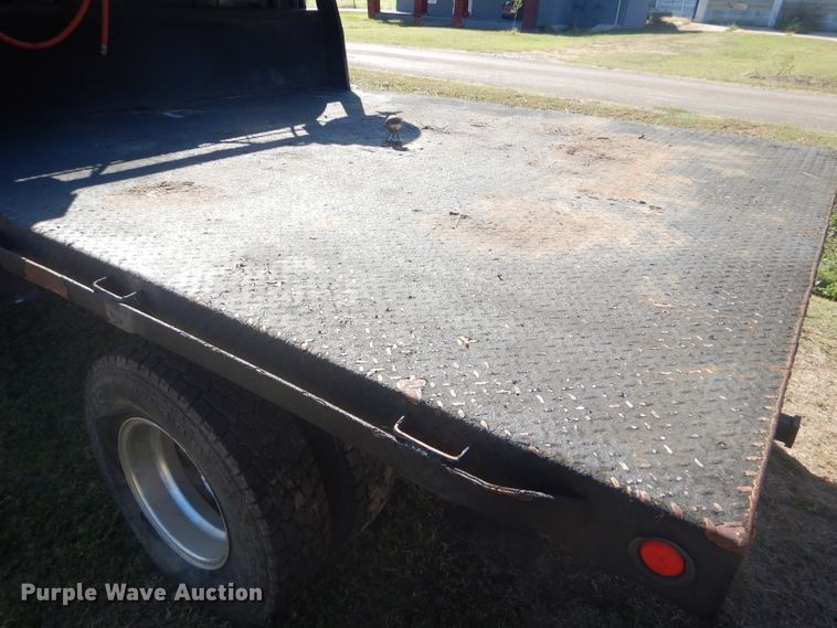 image for item DD4503 1999 Ford F350 Super Duty Crew Cab flatbed pickup truck
