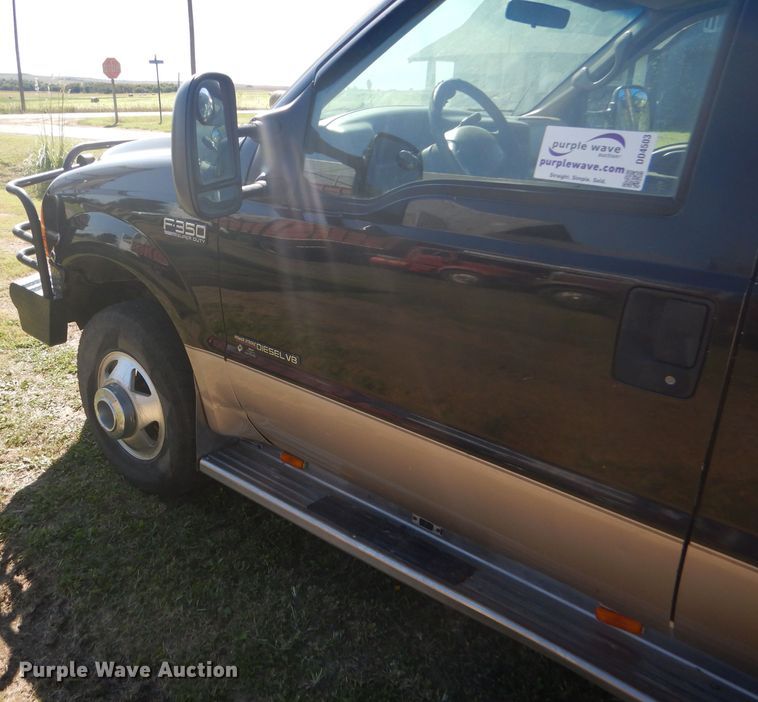 image for item DD4503 1999 Ford F350 Super Duty Crew Cab flatbed pickup truck