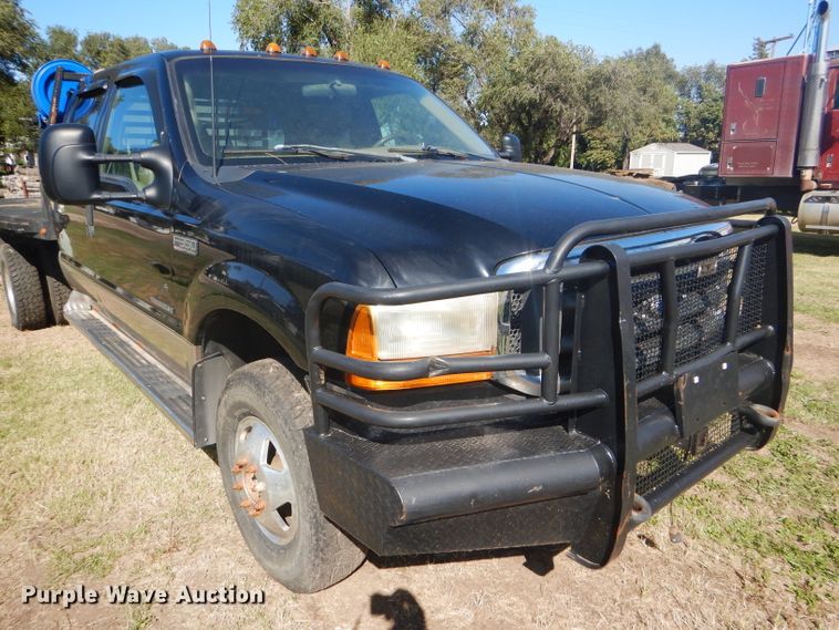 image for item DD4503 1999 Ford F350 Super Duty Crew Cab flatbed pickup truck