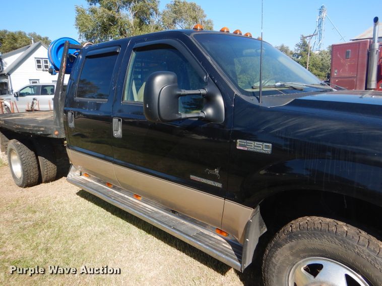image for item DD4503 1999 Ford F350 Super Duty Crew Cab flatbed pickup truck
