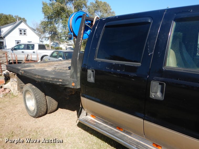 image for item DD4503 1999 Ford F350 Super Duty Crew Cab flatbed pickup truck