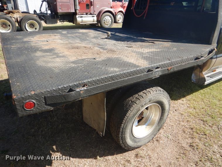 image for item DD4503 1999 Ford F350 Super Duty Crew Cab flatbed pickup truck