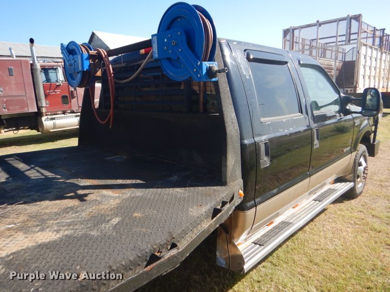 image for item DD4503 1999 Ford F350 Super Duty Crew Cab flatbed pickup truck