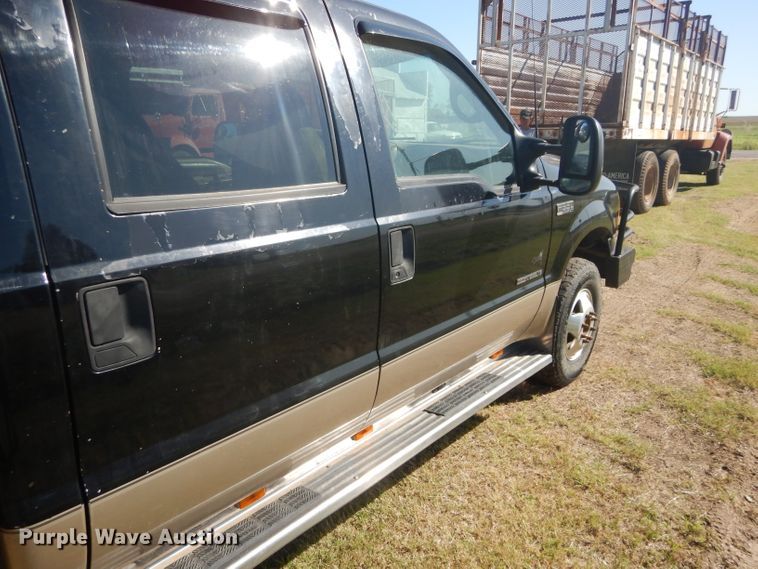 image for item DD4503 1999 Ford F350 Super Duty Crew Cab flatbed pickup truck