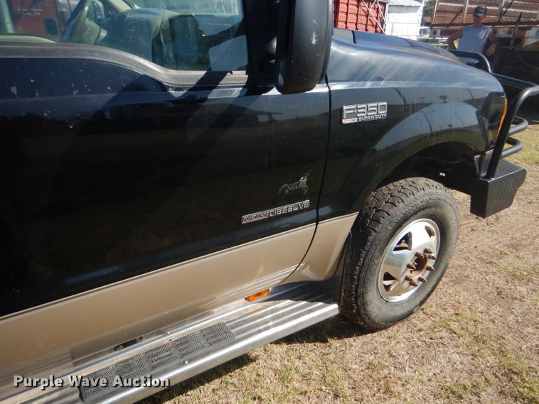 image for item DD4503 1999 Ford F350 Super Duty Crew Cab flatbed pickup truck