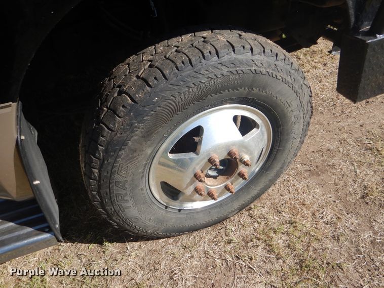 image for item DD4503 1999 Ford F350 Super Duty Crew Cab flatbed pickup truck