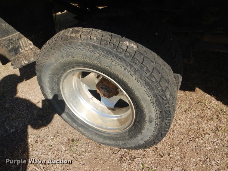 image for item DD4503 1999 Ford F350 Super Duty Crew Cab flatbed pickup truck