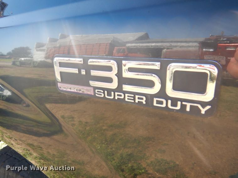 image for item DD4503 1999 Ford F350 Super Duty Crew Cab flatbed pickup truck