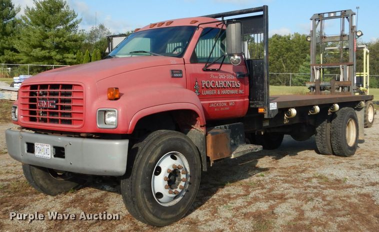 image for item DH2091 1999 GMC C6500 dump flatbed truck with Donkey forklift