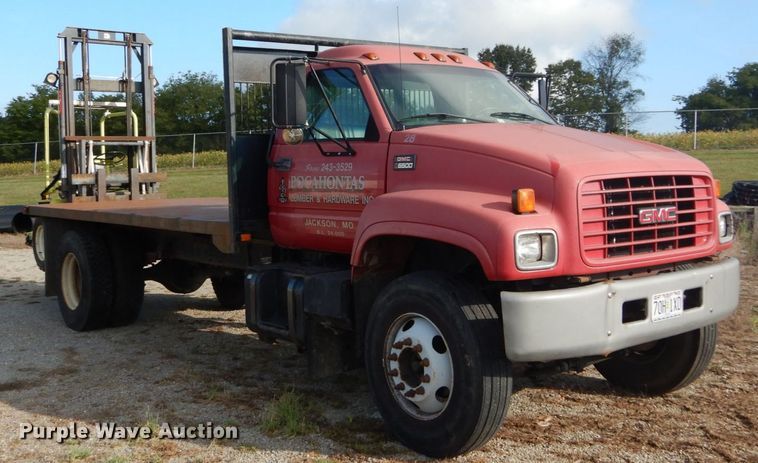 image for item DH2091 1999 GMC C6500 dump flatbed truck with Donkey forklift