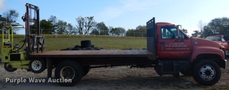 image for item DH2091 1999 GMC C6500 dump flatbed truck with Donkey forklift
