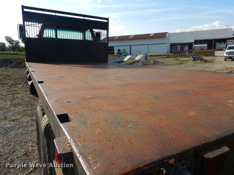 image for item DH2091 1999 GMC C6500 dump flatbed truck with Donkey forklift