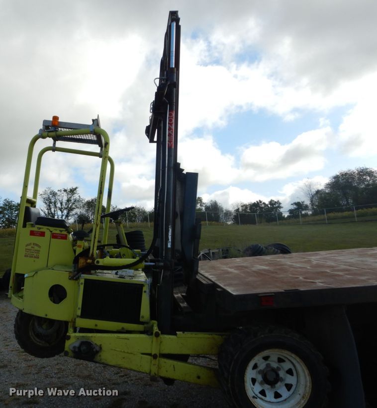 image for item DH2091 1999 GMC C6500 dump flatbed truck with Donkey forklift