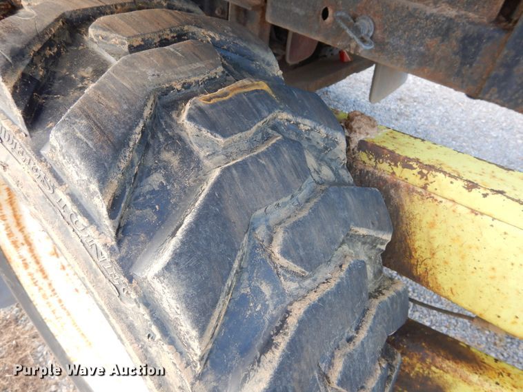 image for item DH2091 1999 GMC C6500 dump flatbed truck with Donkey forklift