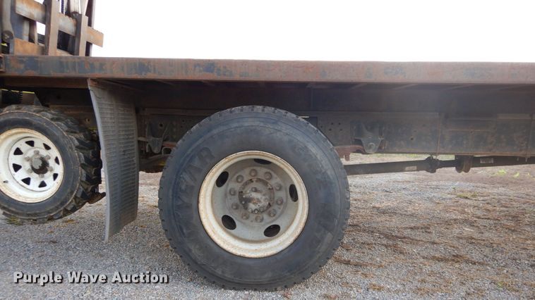 image for item DH2091 1999 GMC C6500 dump flatbed truck with Donkey forklift