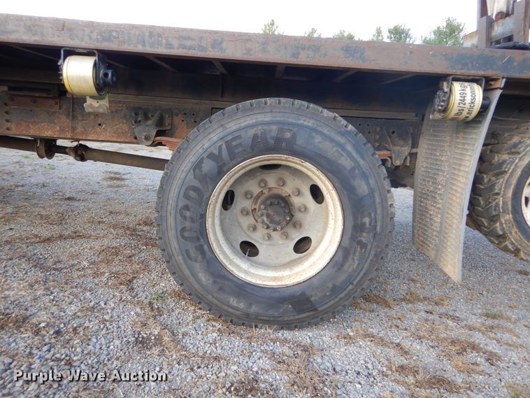 image for item DH2091 1999 GMC C6500 dump flatbed truck with Donkey forklift