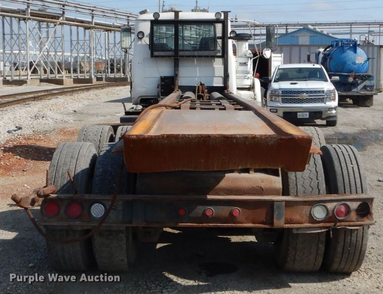 image for item DH2187 1999 Mack DM690S roll off container truck