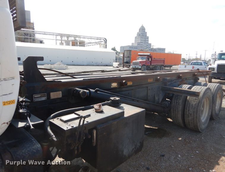 image for item DH2187 1999 Mack DM690S roll off container truck