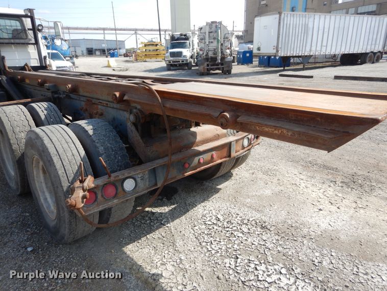 image for item DH2187 1999 Mack DM690S roll off container truck