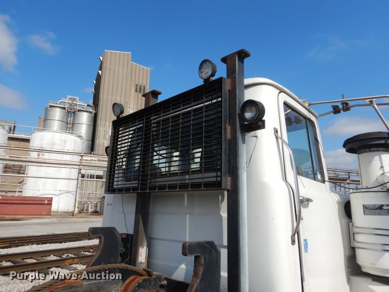 image for item DH2187 1999 Mack DM690S roll off container truck