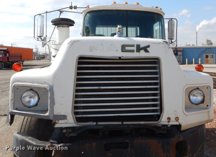 image for item DH2187 1999 Mack DM690S roll off container truck