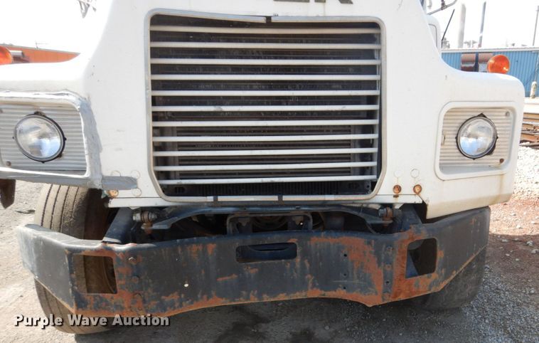 image for item DH2187 1999 Mack DM690S roll off container truck