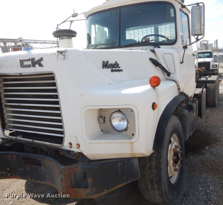 image for item DH2187 1999 Mack DM690S roll off container truck