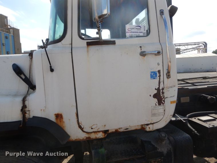 image for item DH2187 1999 Mack DM690S roll off container truck