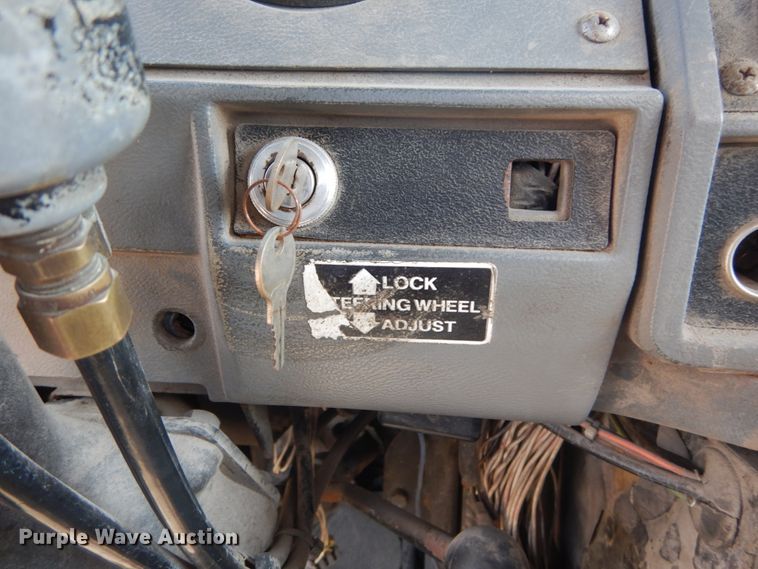 image for item DH2187 1999 Mack DM690S roll off container truck