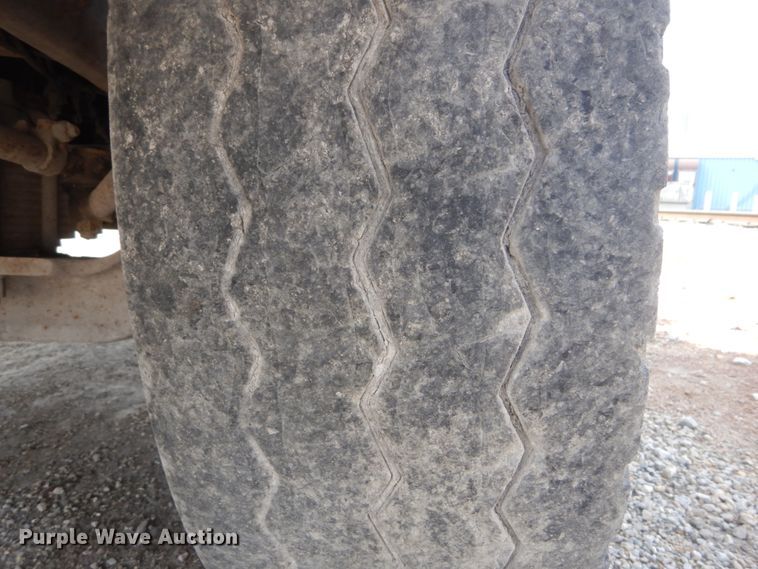 image for item DH2187 1999 Mack DM690S roll off container truck