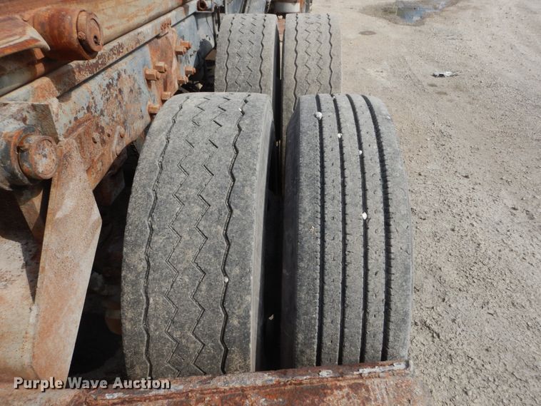 image for item DH2187 1999 Mack DM690S roll off container truck