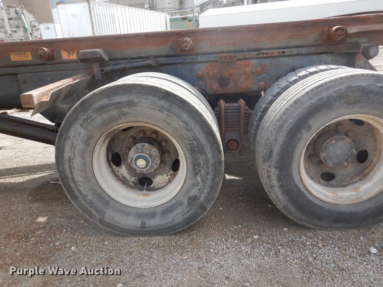 image for item DH2187 1999 Mack DM690S roll off container truck