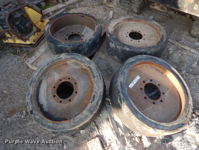 image for item GC9356 (4) 33x6x8 solid tires and wheels