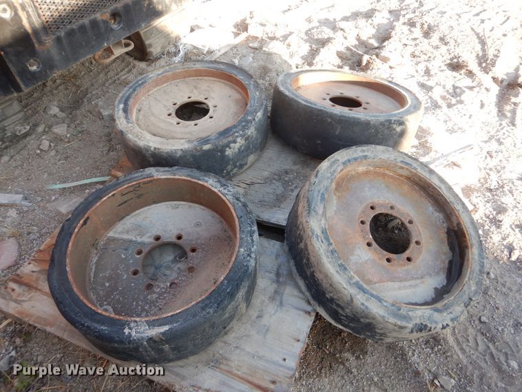 image for item GC9356 (4) 33x6x8 solid tires and wheels