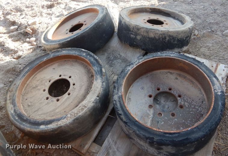 image for item GC9356 (4) 33x6x8 solid tires and wheels